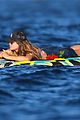 heidi klum rinses off in tiny colorful bikini with roses at her feet 01