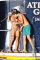 heidi klum rinses off in tiny colorful bikini with roses at her feet 02