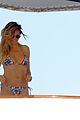 heidi klum rinses off in tiny colorful bikini with roses at her feet 04