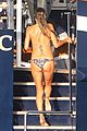 heidi klum rinses off in tiny colorful bikini with roses at her feet 08