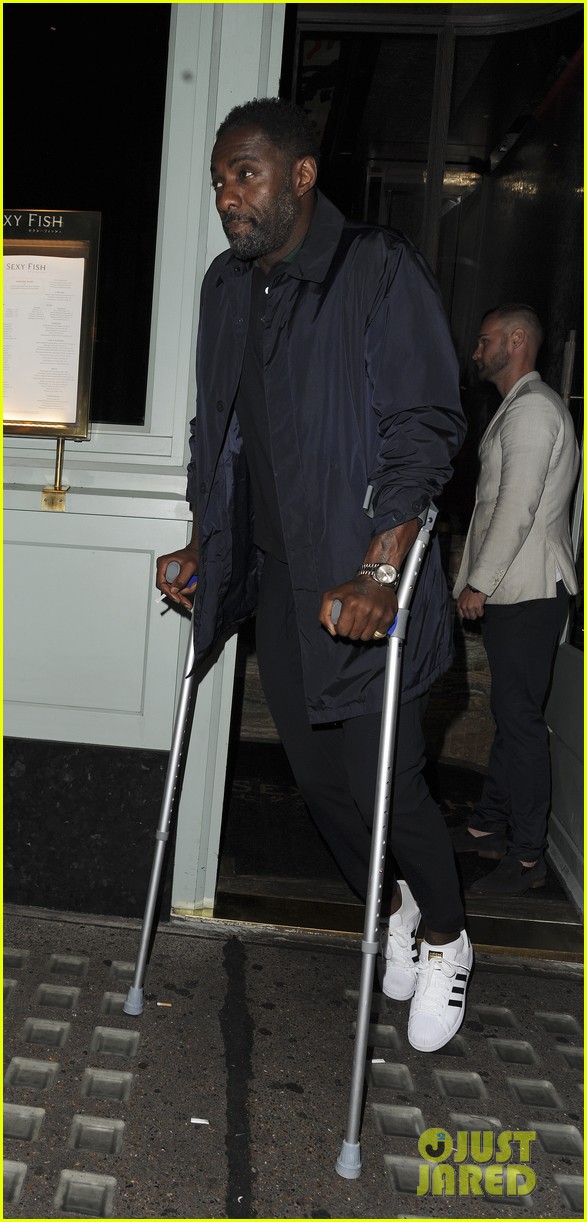 idris elba uses crutches while out in london 03