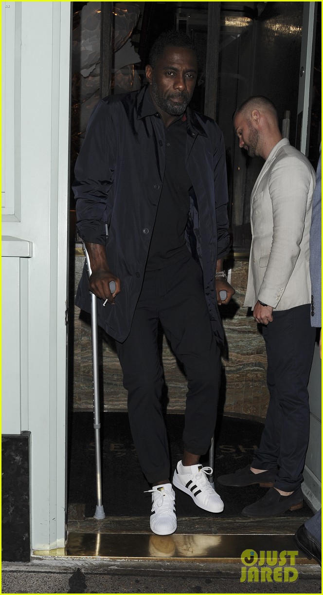 idris elba uses crutches while out in london 06