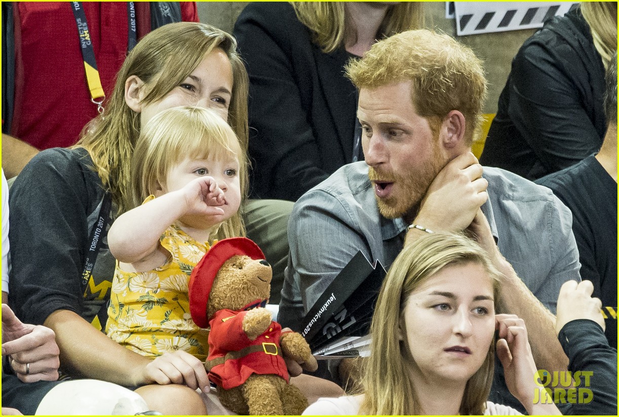 prince harry makes funny faces for a baby at the invictus games 15