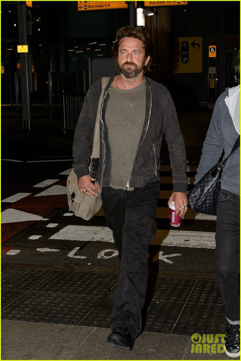 gerard butler arrives in london following motorcycle accident 03