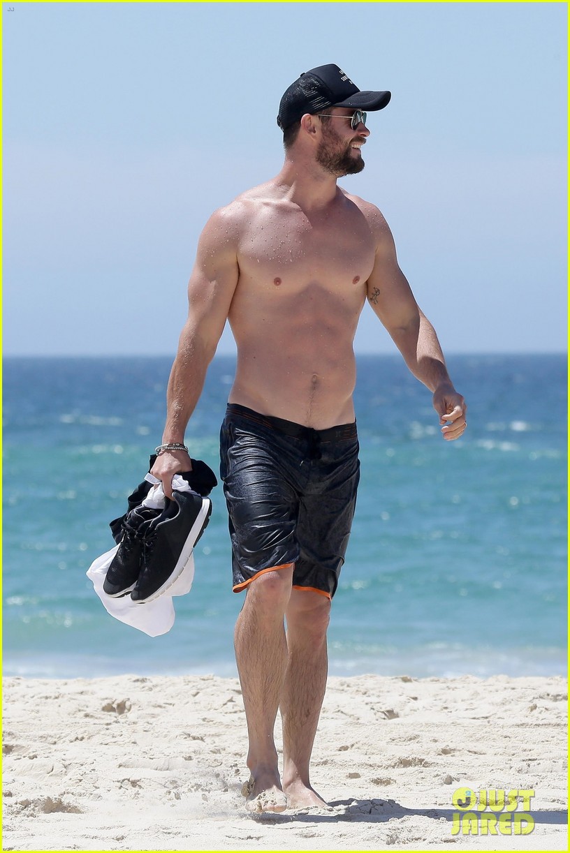 chris hemsworth goes shirtless at beach in australia 293972269