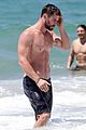 chris hemsworth goes shirtless at beach in australia 02