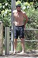 chris hemsworth goes shirtless at beach in australia 03