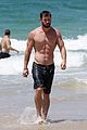 chris hemsworth goes shirtless at beach in australia 07