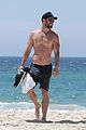 chris hemsworth goes shirtless at beach in australia 10