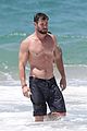 chris hemsworth goes shirtless at beach in australia 15