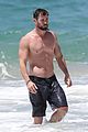 chris hemsworth goes shirtless at beach in australia 16