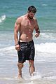 chris hemsworth goes shirtless at beach in australia 18