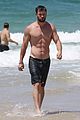 chris hemsworth goes shirtless at beach in australia 19