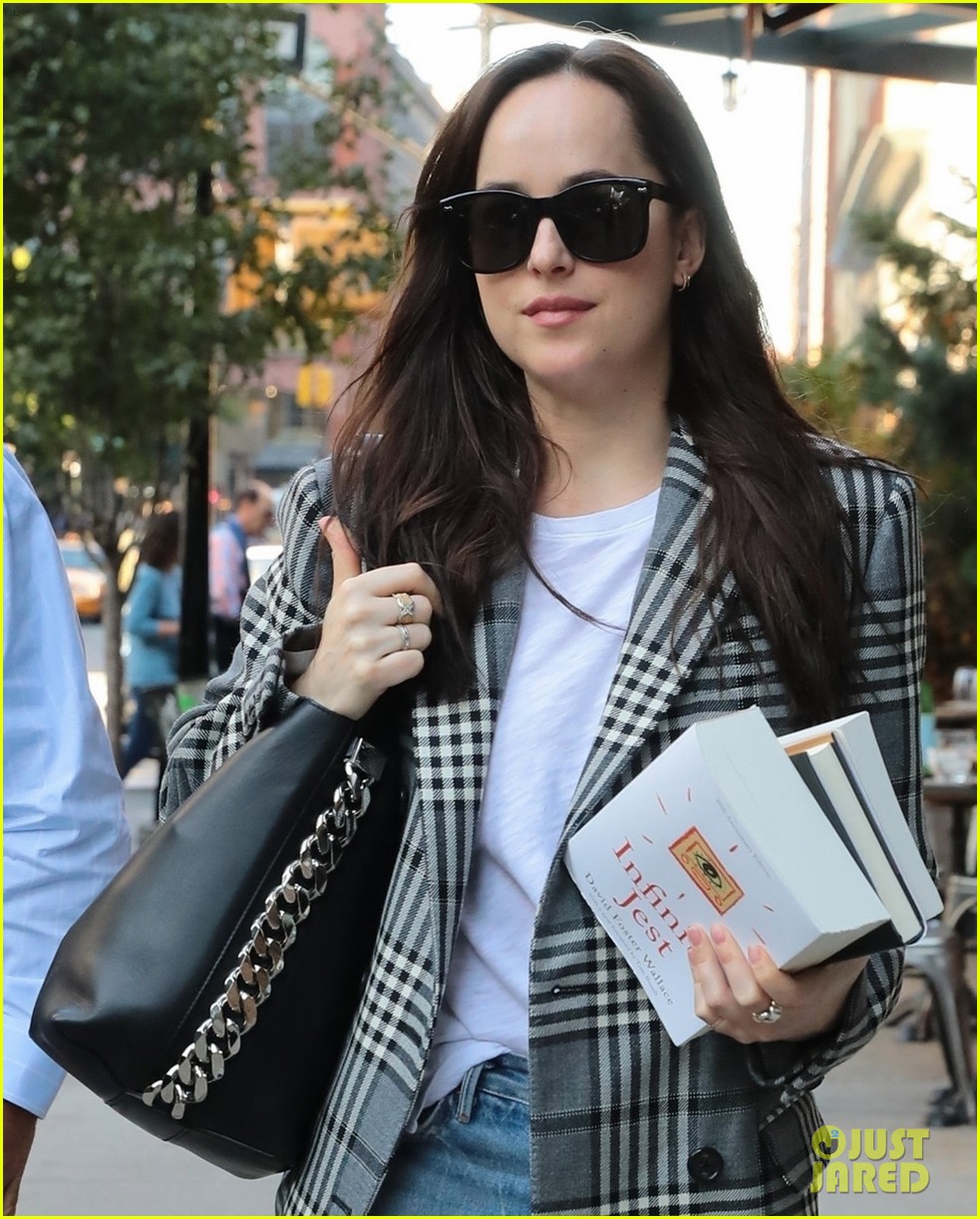 dakota johnson sports long plaid coat while out in nyc 013974706