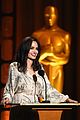 angelina jolie speaks on stage while presenting at governors awards 04