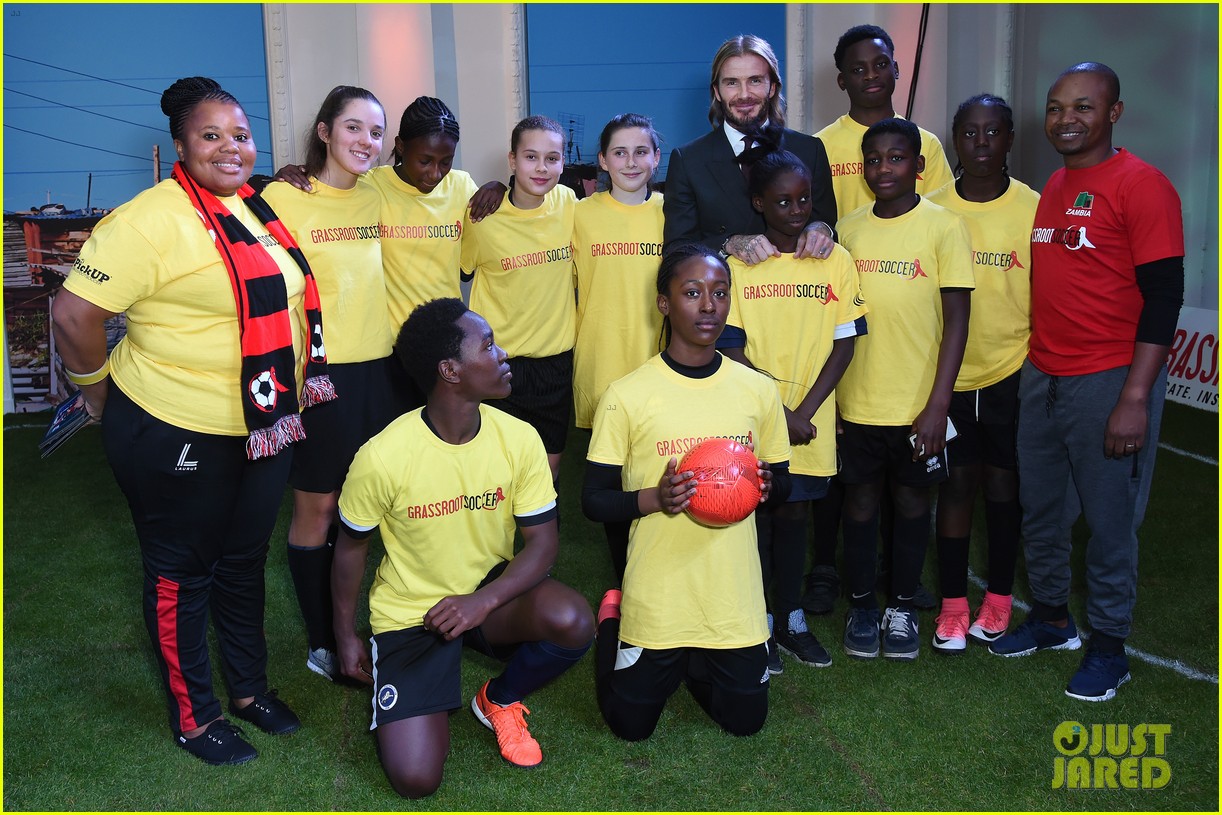 david beckham lets his long hair flow at world aids day event 03