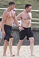 hugh jackman goes shirtless at the beach with his hot trainer 03