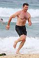 hugh jackman goes shirtless at the beach with his hot trainer 04