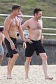 hugh jackman goes shirtless at the beach with his hot trainer 07