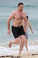 hugh jackman goes shirtless at the beach with his hot trainer 08