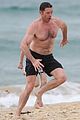 hugh jackman goes shirtless at the beach with his hot trainer 11