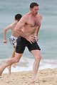 hugh jackman goes shirtless at the beach with his hot trainer 13