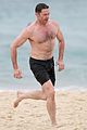 hugh jackman goes shirtless at the beach with his hot trainer 16