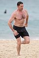 hugh jackman goes shirtless at the beach with his hot trainer 17