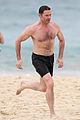 hugh jackman goes shirtless at the beach with his hot trainer 19