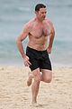 hugh jackman goes shirtless at the beach with his hot trainer 20