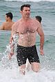 hugh jackman goes shirtless at the beach with his hot trainer 25