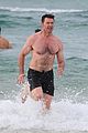 hugh jackman goes shirtless at the beach with his hot trainer 26