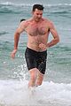 hugh jackman goes shirtless at the beach with his hot trainer 27