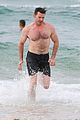 hugh jackman goes shirtless at the beach with his hot trainer 28