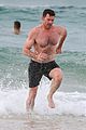 hugh jackman goes shirtless at the beach with his hot trainer 29