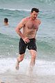 hugh jackman goes shirtless at the beach with his hot trainer 30