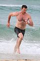hugh jackman goes shirtless at the beach with his hot trainer 32
