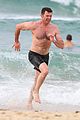 hugh jackman goes shirtless at the beach with his hot trainer 35