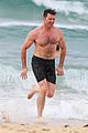 hugh jackman goes shirtless at the beach with his hot trainer 36