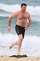 hugh jackman goes shirtless at the beach with his hot trainer 41