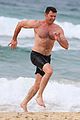 hugh jackman goes shirtless at the beach with his hot trainer 44