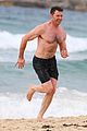 hugh jackman goes shirtless at the beach with his hot trainer 47