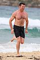hugh jackman goes shirtless at the beach with his hot trainer 49