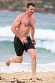 hugh jackman goes shirtless at the beach with his hot trainer 50