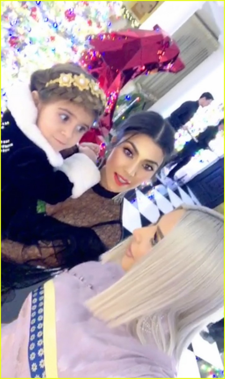 khloe kardashian cradles baby bump at christmas eve party 094004257