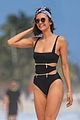nina dobrev wears a swimsuit with zippers 02