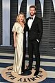 miley cyrus and liam hemsworth share super sweet moment at vanity fairs oscars party 16