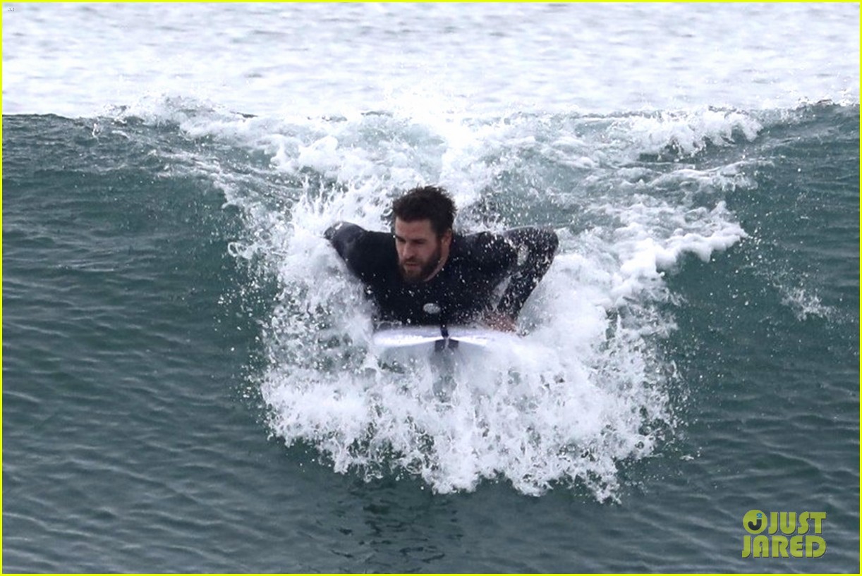 liam hemsworth puts surfing skills on display in malibu 15