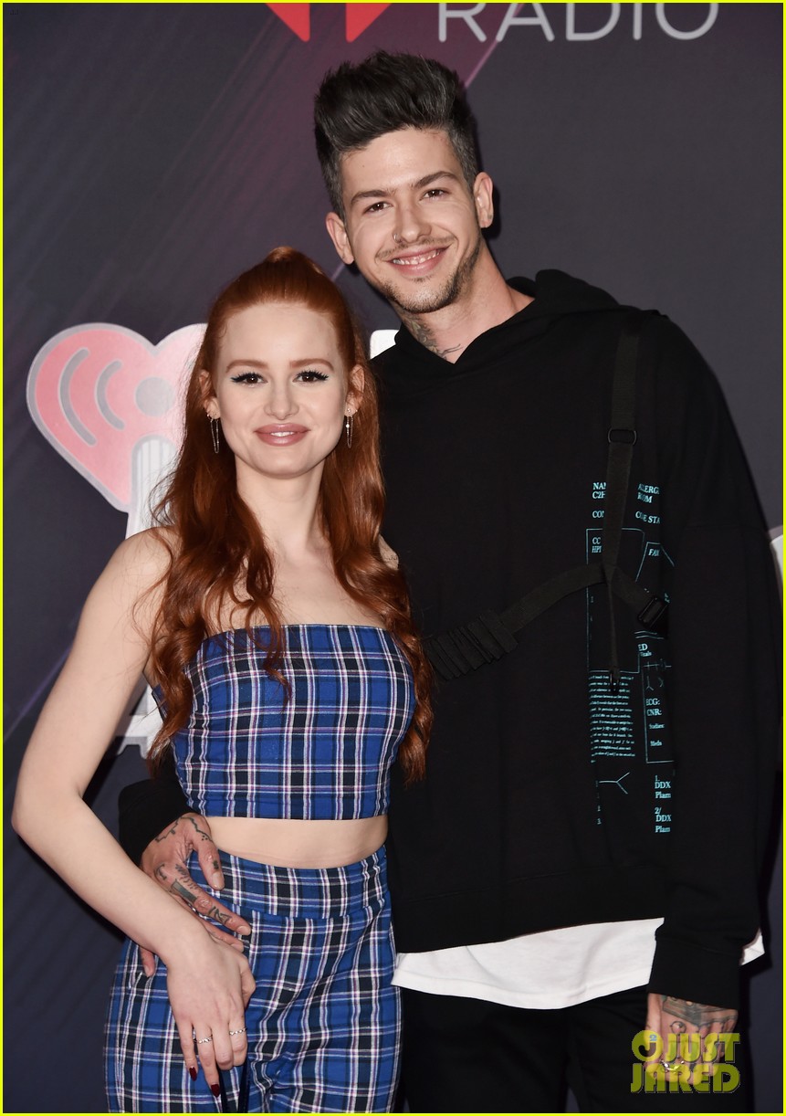 madelaine petsch gets a kiss from travis mills at iheart radio music awards 014049210