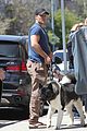 henry cavill shows off buff biceps taking his dog for a walk 04